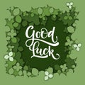 Good Luck calligraphy logo on green paper cut clover background Royalty Free Stock Photo