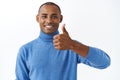 Good luck, nice work. Close-up portrait of satisfied, handsome african american man show thumb-up in like, approval or
