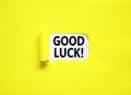 Good luck symbol. Concept words Good luck on beautiful white paper. Beautiful yellow paper background. Business, motivational good Royalty Free Stock Photo