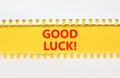 Good luck symbol. Concept words Good luck on beautiful yellow paper. Beautiful white paper background. Business, motivational good Royalty Free Stock Photo