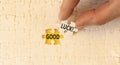 Good luck symbol. Concept words Good luck on beautiful white paper puzzle. Beautiful yellow background. Businessman hand. Business Royalty Free Stock Photo