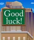 Good luck. Wishing success text on a billboard sign atop a brick building.