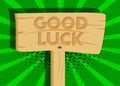 Good luck. Wishing success text on Wooden sign.