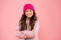 Good mood any weather. cheerful child in warm winter clothes. seasonal fashion for kids. small beauty pink wall. girl