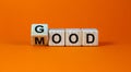 Good mood symbol. Fliped a wooden cube and changed the word `good` to `mood`. Beautiful orange background, copy space. Busines
