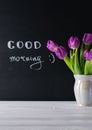 Good morning card, chalk board lettering and beautiful purple tulips bouquet Royalty Free Stock Photo