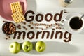 Good morning coffee grain beans inscription with bright table background. Copy space for advertising products and decoration.