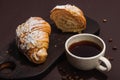 Good morning concept. Breakfast with cup of coffee and fresh croissant. Sweet creamy sauce