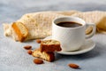 Good morning concept - breakfast frothy espresso coffee accompanied by delicious Italian almond cantuccini biscuits Royalty Free Stock Photo