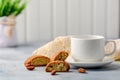 Good morning concept - breakfast frothy espresso coffee accompanied by delicious Italian almond cantuccini biscuits Royalty Free Stock Photo