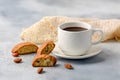 Good morning concept - breakfast frothy espresso coffee accompanied by delicious Italian almond cantuccini biscuits Royalty Free Stock Photo