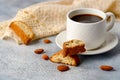 Good morning concept - breakfast frothy espresso coffee accompanied by delicious Italian almond cantuccini biscuits Royalty Free Stock Photo