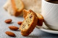 Good morning concept - breakfast frothy espresso coffee accompanied by delicious Italian almond cantuccini biscuits Royalty Free Stock Photo