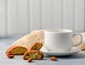 Good morning concept - breakfast frothy espresso coffee accompanied by delicious Italian almond cantuccini biscuits Royalty Free Stock Photo