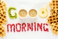 Good morning concept. `Good morning` words laid out with pieces of fruit and pomegranate seeds. Royalty Free Stock Photo