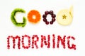 Good morning concept. `Good morning` words laid out with pieces of fruit and pomegranate seeds Royalty Free Stock Photo