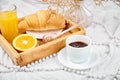 Good morning. Continental breakfast on white bed sheets.