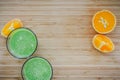 Good morning: Fresh green smoothies and fruits on wooden background, healthy breakfast. Text space