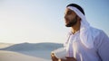 Good morning for male sheikh in middle of huge desert over cup o Royalty Free Stock Photo