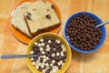 Bole of cereals and a plate with sweet bread Royalty Free Stock Photo