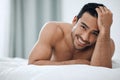 Good morning to you, too. a handsome young man lying on his bed. Royalty Free Stock Photo