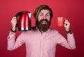 Good morning. warm your day. bearded man. drink hot beverage. presenting kitchen utensils. good quality. mature hipster