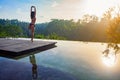 Good morning with woman yoga meditating on sunrise background. Royalty Free Stock Photo