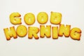 Good morning word from alphabet biscuits on white background