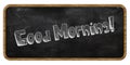 GOOD MORNING written in chalk on blackboard. Wood frame.