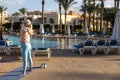 Good morning with yoga meditating on sunrise background. Active woman practicing at villa poolside to keep fit and Royalty Free Stock Photo