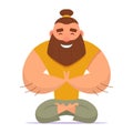 Good-natured man with beard and bump on his head meditates in lotus position. Yoga in comfortable clothes