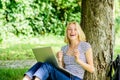 Good news. girl blogger write post for social network. modern woman with notebook blogging outdoor. girl runs her blog