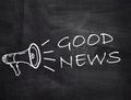 Good News text with megaphone on chalkboard background Royalty Free Stock Photo