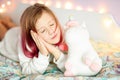 Good night. beautiful kids room. Girl hugs a toy Royalty Free Stock Photo