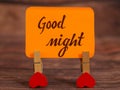 Good Night text attached with heart clip. Royalty Free Stock Photo