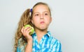 Good nutrition is essential to good health. Kid girl eat green apple fruit. Vitamin nutrition concept. Reasons eat apple