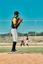 A really good pitcher is tough to beat. a young baseball player getting ready to pitch the ball during a game outdoors. Royalty Free Stock Photo