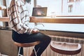 This is a good place to work! Cropped picture of a young woman who is sitting at a laptop in a cafe