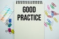 Good Practice text message written on notepad with stationery flat lay on white background Royalty Free Stock Photo