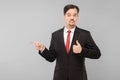 Good product! Success businessman pointing finger to copy space Royalty Free Stock Photo