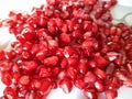 The good quality pomegranat seeds in white plate.