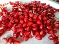 The good quality pomegranat seeds in white plate.