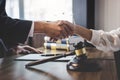 Good service cooperation of Consultation between a male lawyer and business woman customer, Handshake after good deal agreement, Royalty Free Stock Photo