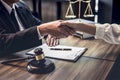 Good service cooperation of Consultation between a male lawyer and business woman customer, Handshake after good deal agreement, Royalty Free Stock Photo