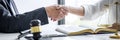 Good service cooperation of Consultation between a male lawyer and business woman customer, Handshake after good deal agreement, Royalty Free Stock Photo