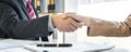 Good service cooperation of Consultation between a male lawyer and business woman customer, Handshake after good deal agreement, Royalty Free Stock Photo