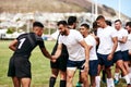 Good sportsmanship makes for a good game. a group of young men shaking hands during a game of rugby. Royalty Free Stock Photo