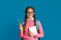 Good student. Smiling teenage girl holding notebook and pencil Royalty Free Stock Photo