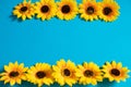 Artificial sunflower on blue background with copy space