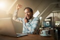 Good things come to those who hustle. a young man talking on his phone while using his laptop. Royalty Free Stock Photo